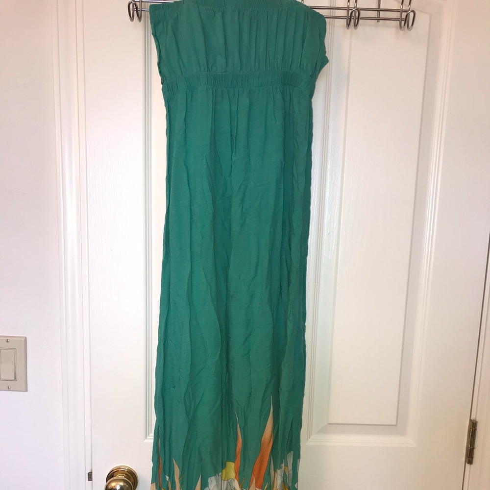 Green maxi dress with floral print at the bottom